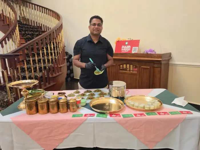Paan Station team member preparing paan at a fully arranged live event counter