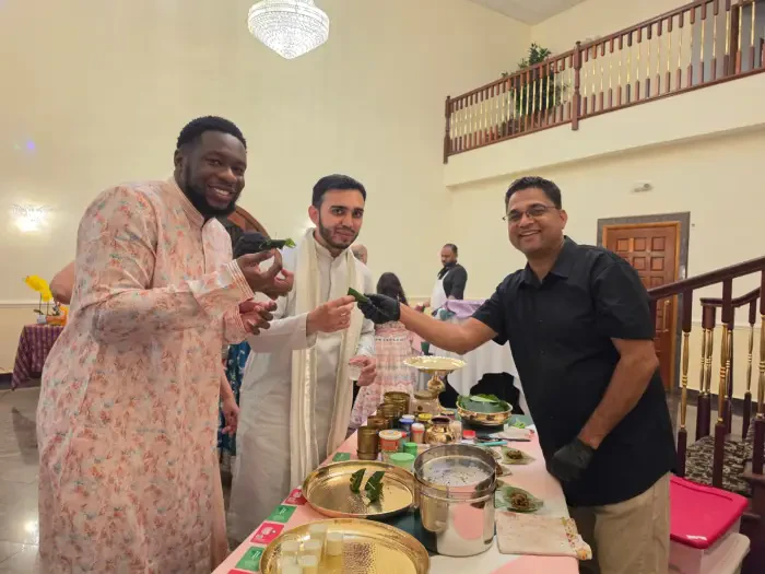 Guests sharing freshly prepared paan at a Paan Station event counter